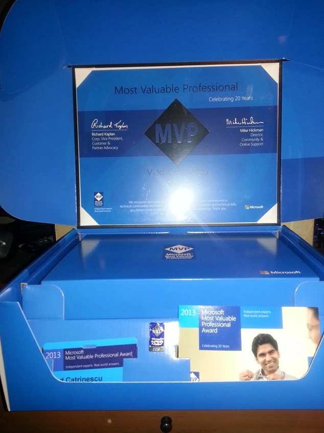 Microsoft MVP 2013 award kit opened to show Vlad Catrinescu's Most Valuable Professional certificate marking 20 years of the program