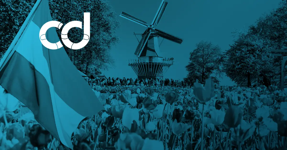CollabDays logo over a blue-tinted photo of a Dutch windmill, tulip fields and a crowd waving flags